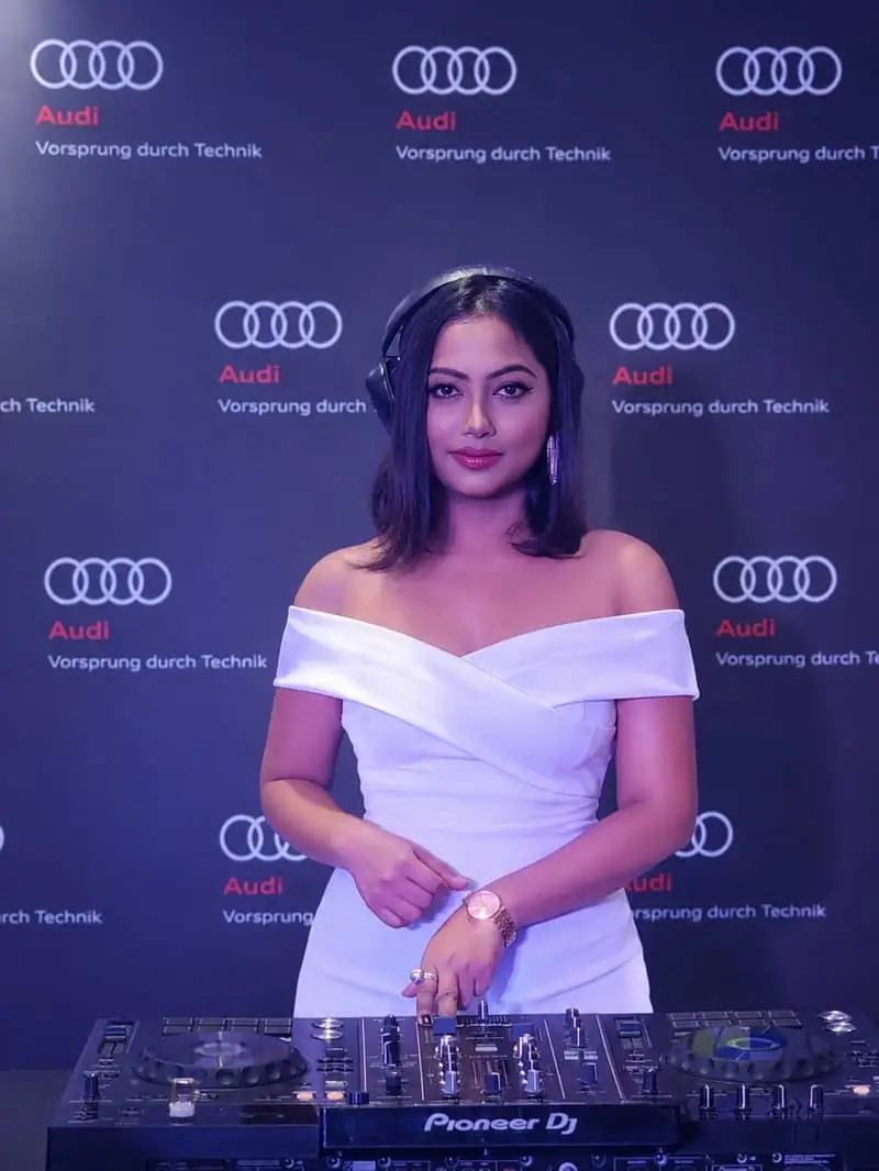 DJ Dazzling in a white gown at an Audi event